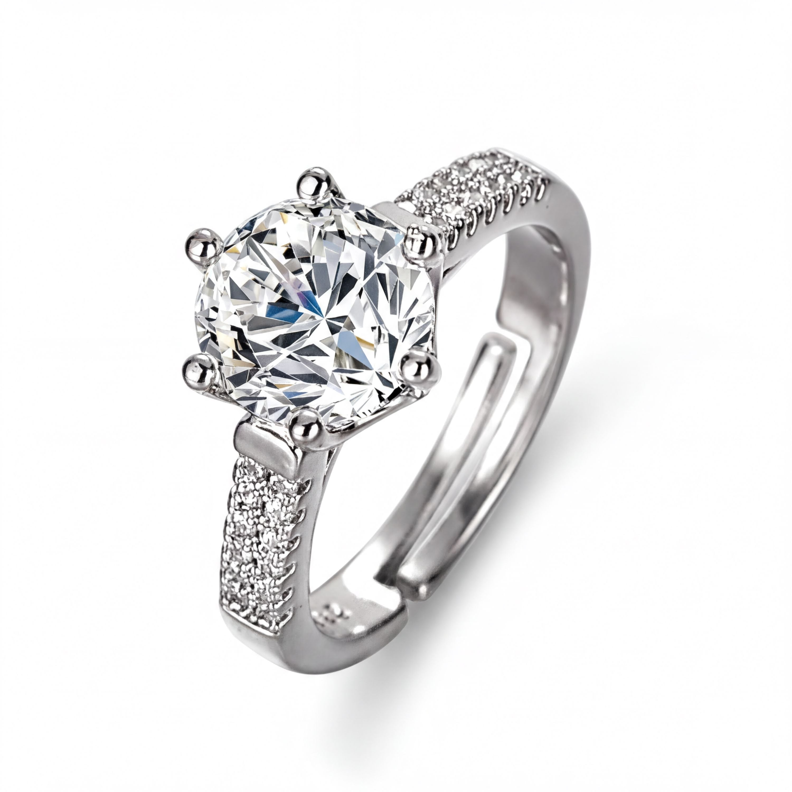 A silver ring with a large, clear gemstone set in the center, surrounded by smaller diamonds.