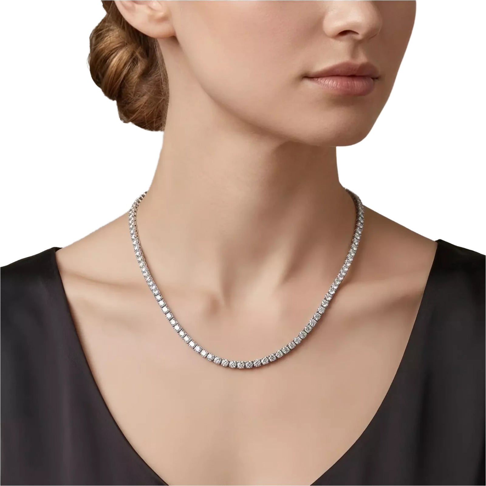 A close-up of a woman's neck and chest wearing a diamond necklace.